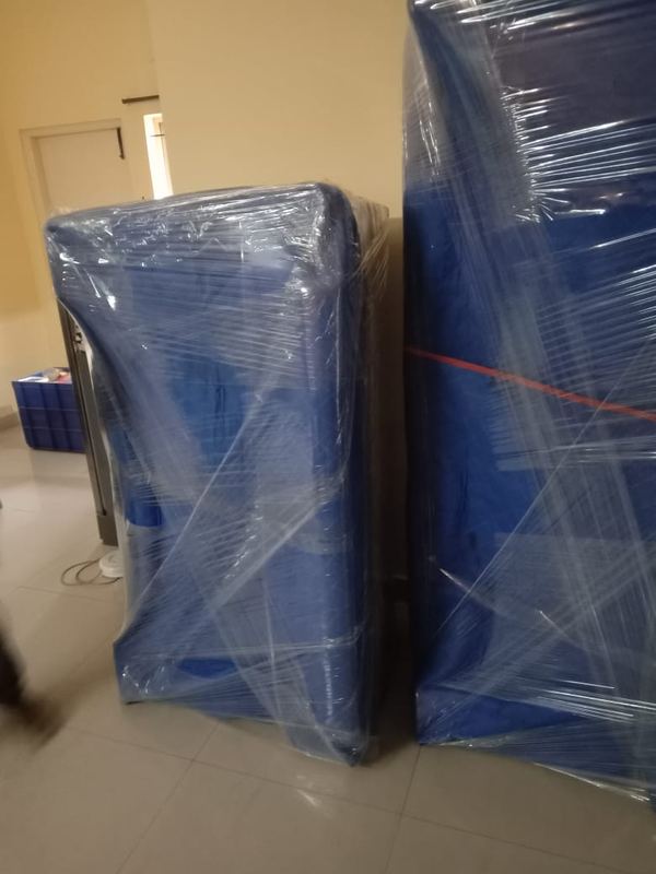 Tirupati Packers and Movers loading a goods vehicle in Avalahalli