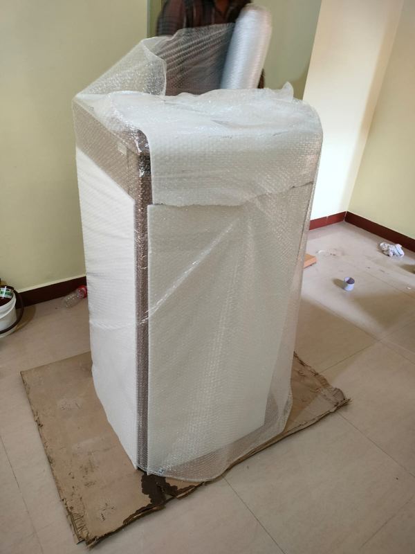 Refrigerator wrapped and secured for transport
