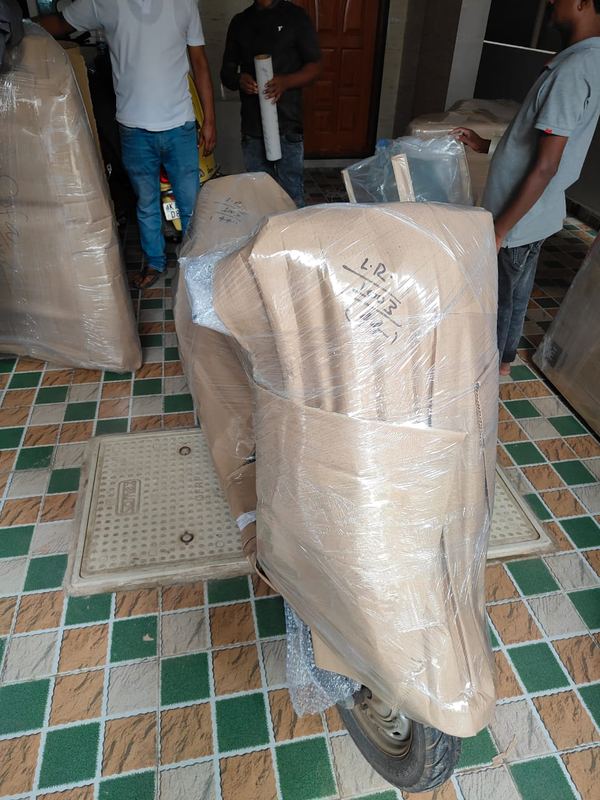 Tirupati Packers and Movers crew loading a household consignment in Yelahanka
